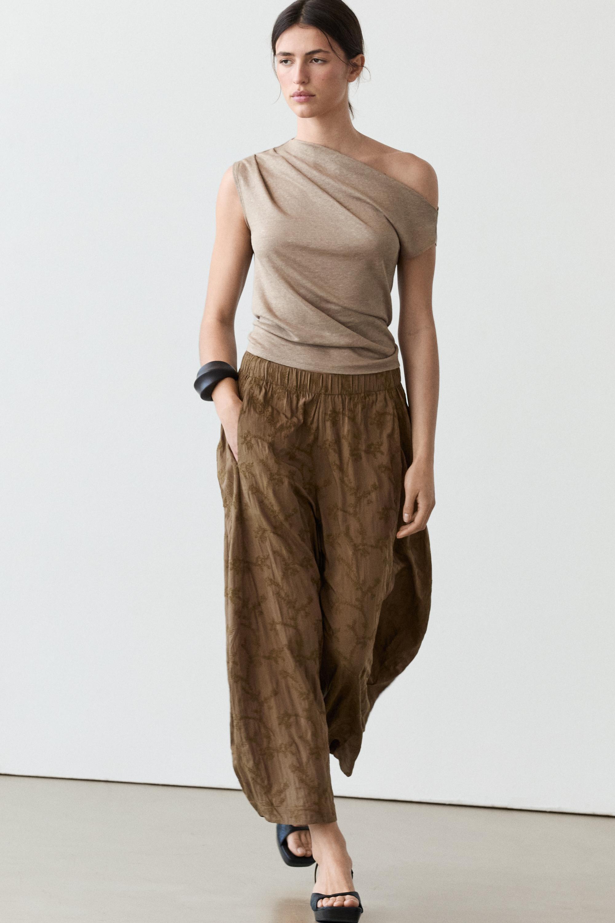 Trousers with embroidered detail and elastic waistband